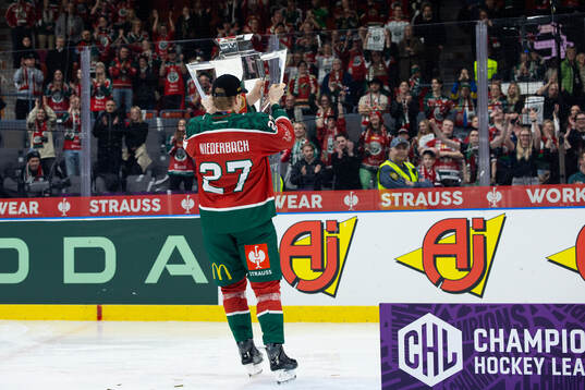 Theodor Niederbach of Frölunda celebrates with the trophy