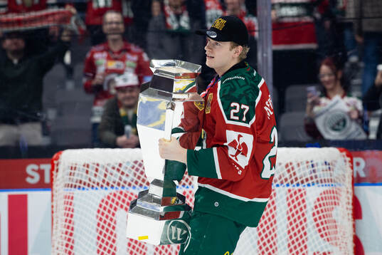 Theodor Niederbach of Frölunda celebrates with the trophy