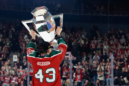 Tom Nilsson of Frölunda celebrates with the trophy