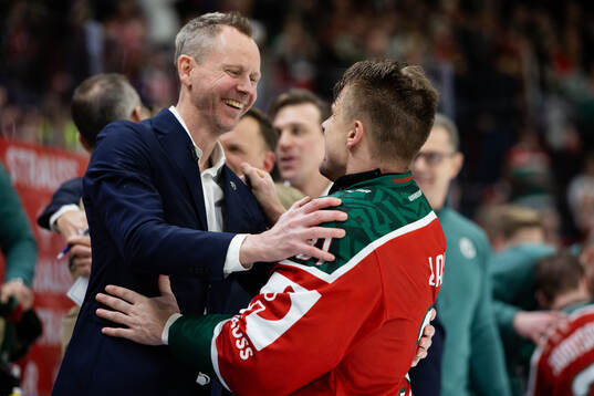 Coach Robert Ohlsson and Nicklas Lasu celebrate