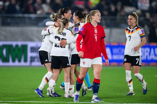 Jule Brand of Germany celebrate with teammates