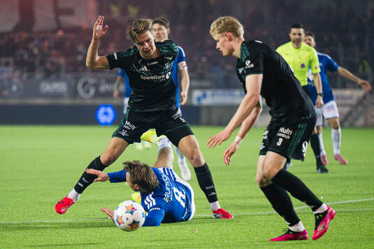 Håkon Volden of Rosenborg and Fredrik Gulbrandsen of Molde