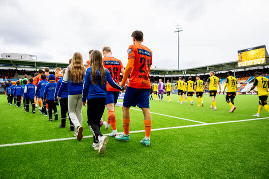 Players of Aalesund and Lillestrøm enter the pitch