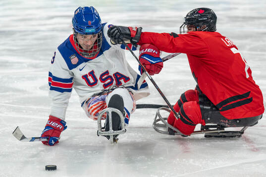 Jack Wallace USA evades Zach Lavin CAN
