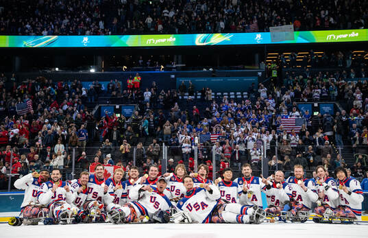 Gold Medallists United States of America Ice Hickey team sit