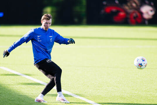 Goalkeeper Mathias Dyngeland of Brann warms up