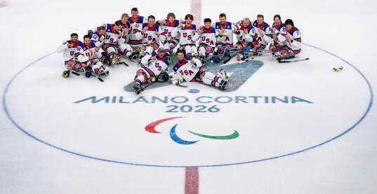 Gold Medallists United States of America Ice Hickey team sit