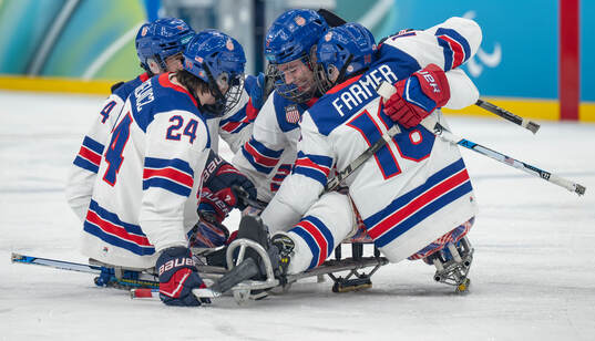 Jack Wallace USA celebrates with Declan Farmer USA and
