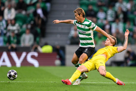 Hidemasa Morita of Sporting and Ole Didrik Blomberg of