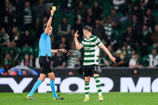 Sandro Schärer, referee shows a yellow card for Iván