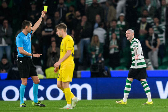 Sandro Schärer, referee shows a yellow card for Nuno
