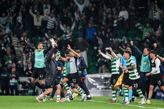 Players of Sporting celebrate