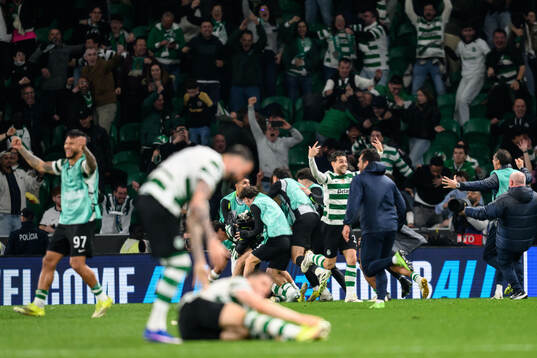 Players of Sporting celebrate