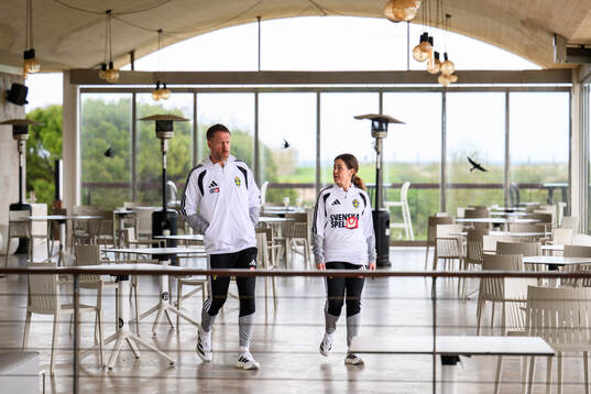 Head coach Graham Potter and media officer Petra Thorén of