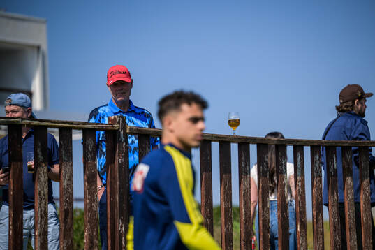 Spectators with beers watch Yasin Ayari of the Swedish