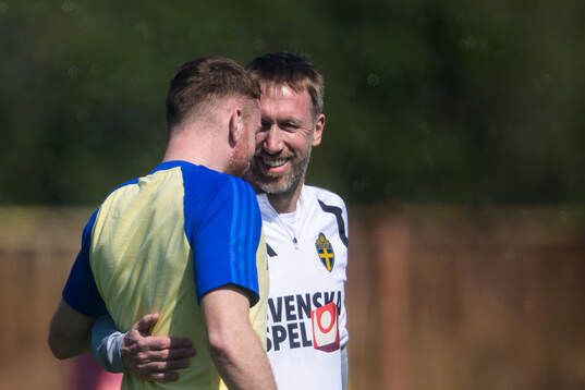 Injured player Dejan Kulusevski gets a hug from head coach