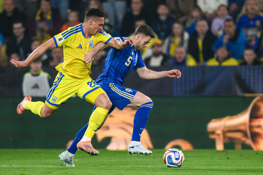 goalkeeper Dmytro Riznyk of Ukraine and Gabriel Gudmundsson