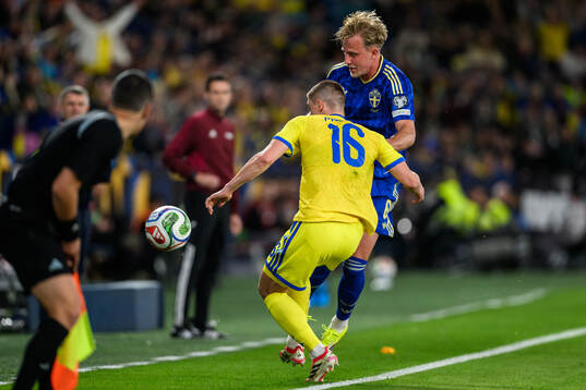 Vitaliy Mykolenko of Ukraine and Herman Johansson of Sweden