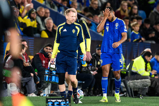Isak Hien of Sweden leaves the pitch with an injury
