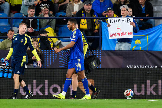Isak Hien of Sweden leaves the pitch with an injury