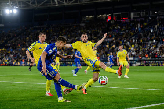 Yasin Ayari of Sweden against Vitaliy Mykolenko and Ivan
