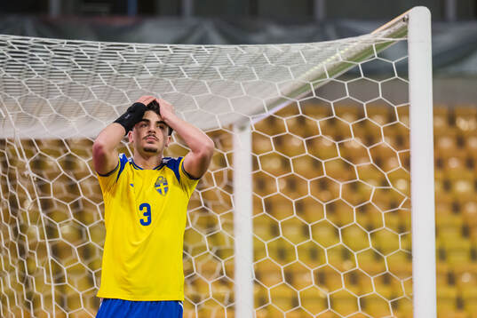 Bleon Kurtulus of Sweden looks dejected