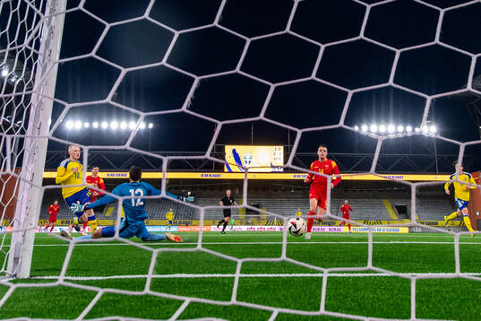 Marcus Rafferty of Sweden scores 1-1 past goalkeeper