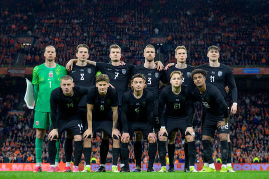 The starting eleven of Norway pose for a team photo