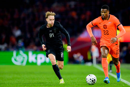 Andreas Schjelderup of Norway and Denzel Dumfries of