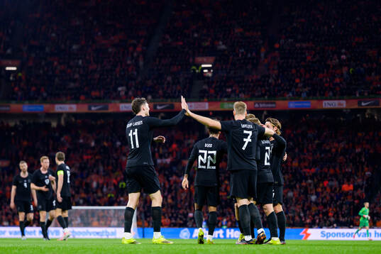 Andreas Schjelderup of Norway celebrates with teammates