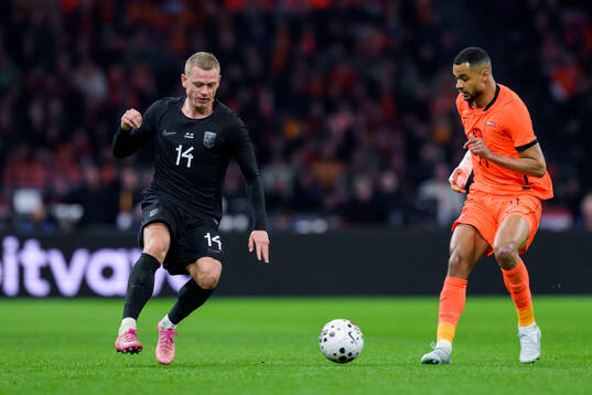 Julian Ryerson of Norway and Cody Gakpo of Netherlands