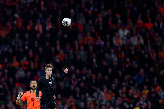 Cody Gakpo of Netherlands and Felix Horn Myhre of Norway