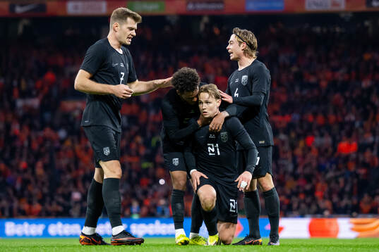 Andreas Schjelderup of Norway celebrates with teammates