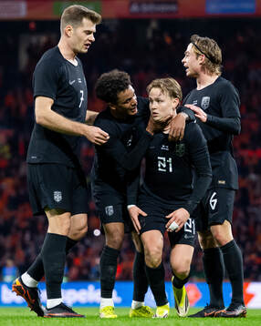 Andreas Schjelderup of Norway celebrates with teammates