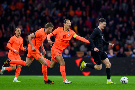 Virgil van Dijk of Netherlands and Jørgen Strand Larsen of