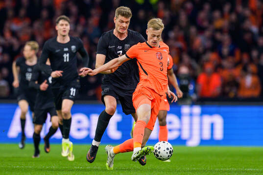 Alexander Sørloth of Norway and Jan Paul van Hecke of