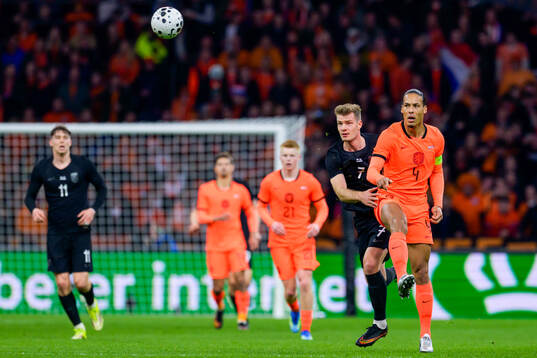 Alexander Sørloth of Norway and Virgil van Dijk of