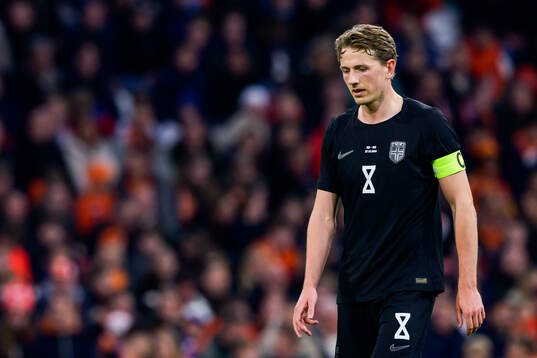 Sander Berge of Norway looks dejected
