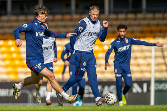 Henrik Falchener and Erling Braut Haaland of the Norwegian