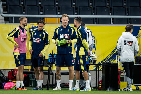 Victor Eriksson and goalkeeper Kristoffer Nordfeldt of the