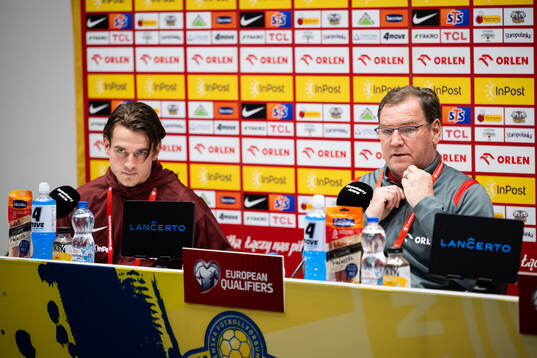 Jakub Kaminski and head coach Jan Urban of Poland's