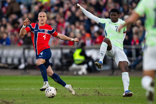 Leo Østigård of Norway and Breel Embolo of Switzerland