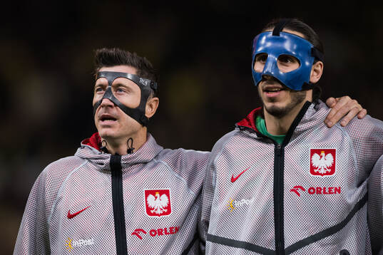 Robert Lewandowski and goalkeeper Kamil Grabara of Poland