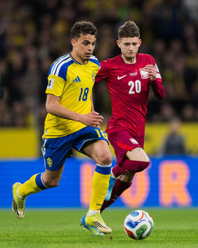 Yasin Ayari of Sweden and Sebastian Szymanski of Poland