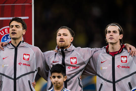 Jakub Kiwior, Matty Cash and Jakub Kaminski of Poland