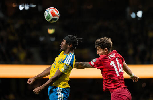 Anthony Elanga of Sweden and Jakub Kiwior of Poland