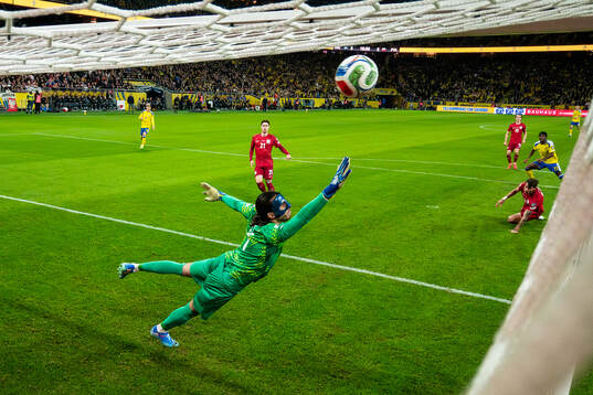 Anthony Elanga of Sweden scores the 1-0 goal behind