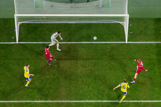 Karol Swiderski of Poland scores the 2-2 goal against