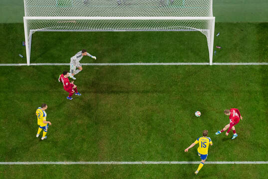 Karol Swiderski of Poland scores the 2-2 goal against