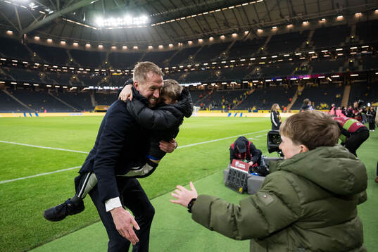 Head coach Graham Potter of Sweden celebrate with family